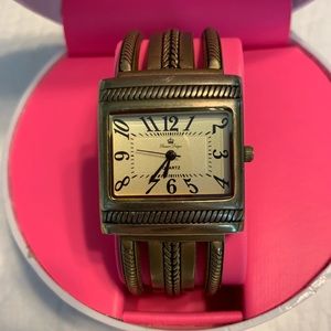 Brass tone hinged bangle watch